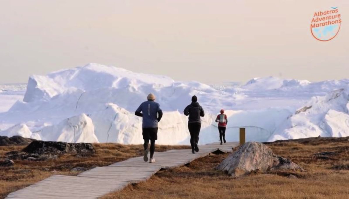 Runners at the beautiful Icefjord Midnight Marathon