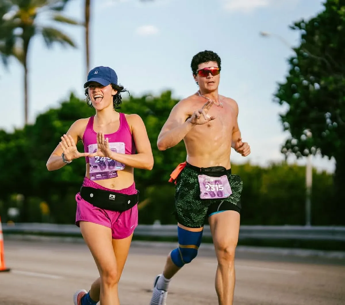 male and female runners at miami marathon