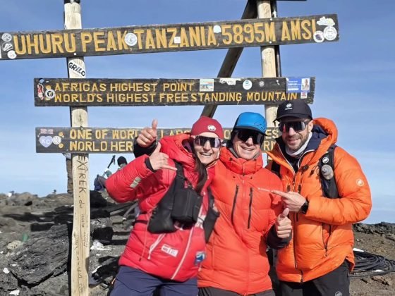 Alexis Trougnou - 2026 Kilimanjaro FKT - on summit with guides