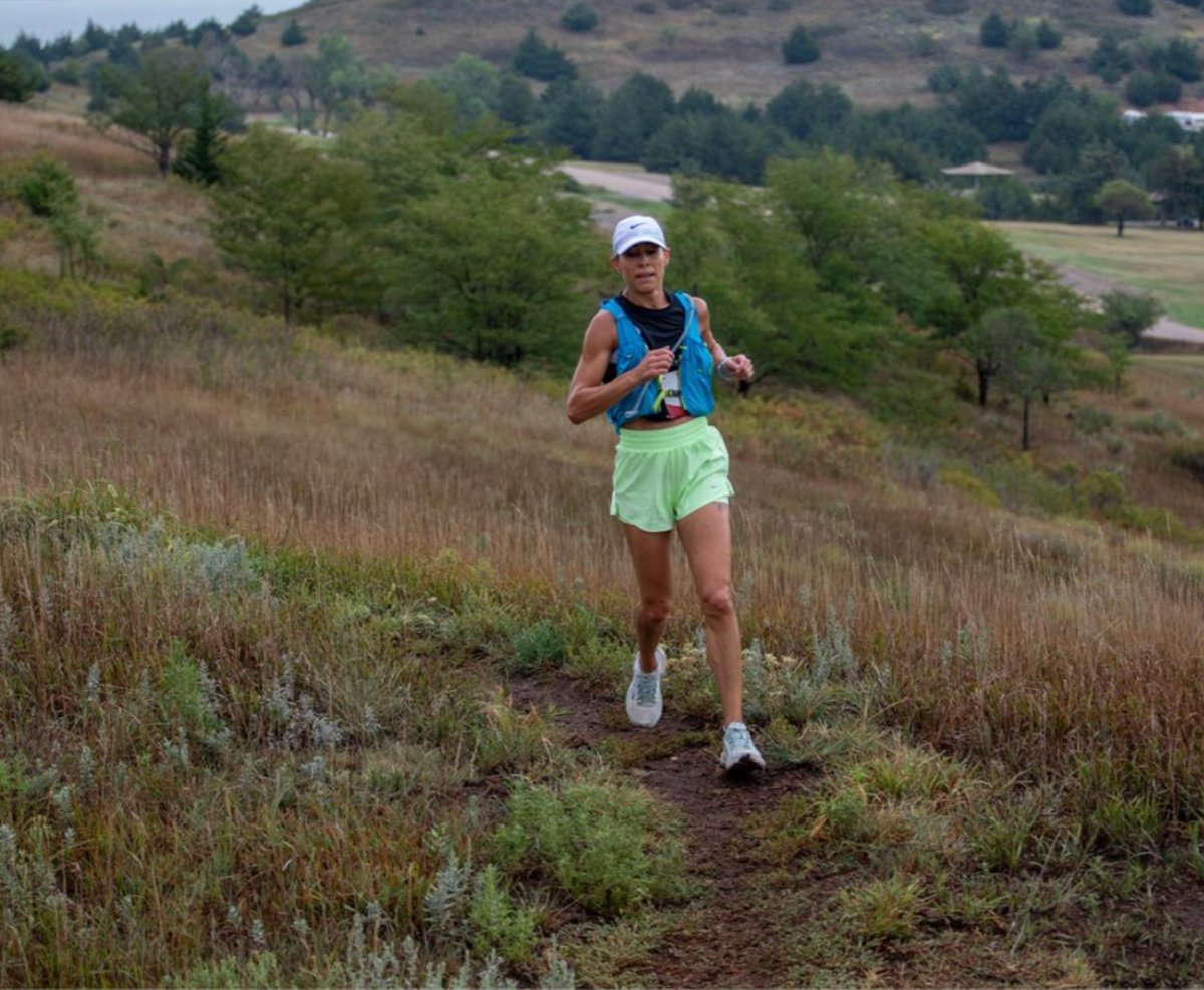 woman running hell creek half marathon